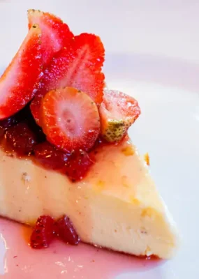 Burnt Basque Cheesecake with strawberry & basil compote, a delicious dessert cake from the pastry menu at Rah Nah Restaurant Lovina.
