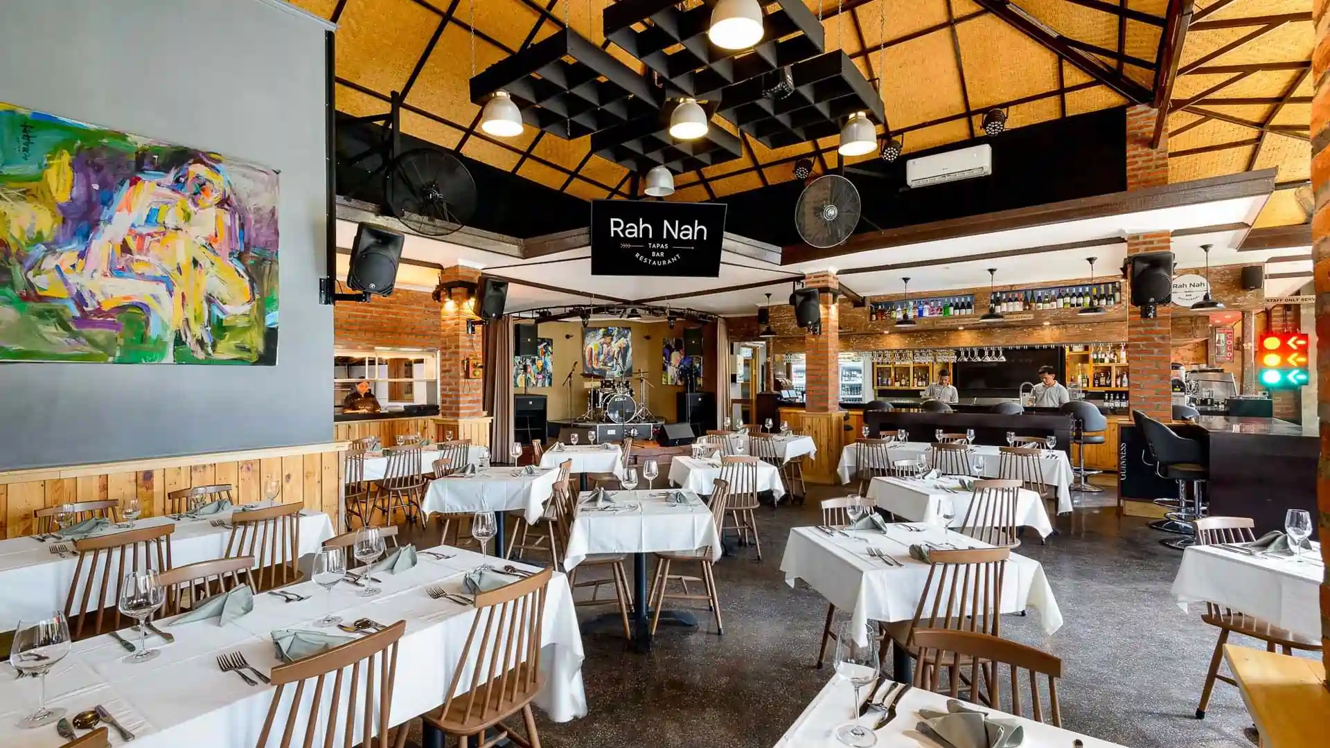 Spacious dining area and live music stage at Rah Nah Tapas, a premier Lovina bar and restaurant.