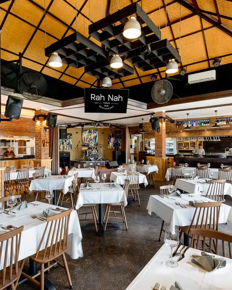 Spacious dining area and live music stage at Rah Nah Tapas, a premier Lovina bar and restaurant.