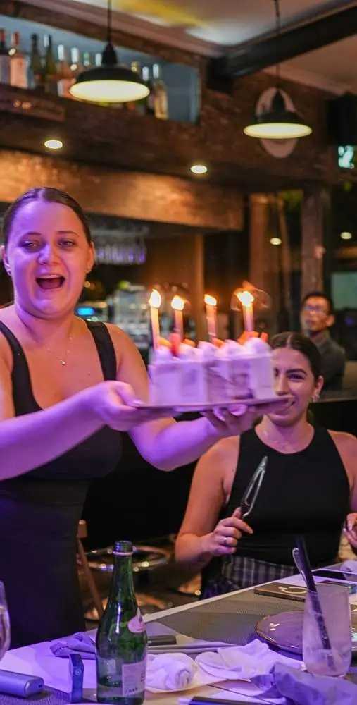 Rah Nah serves as the perfect birthday party venue in Lovina, featuring a warm atmosphere where guests celebrate special moments with a beautiful candlelit cake.